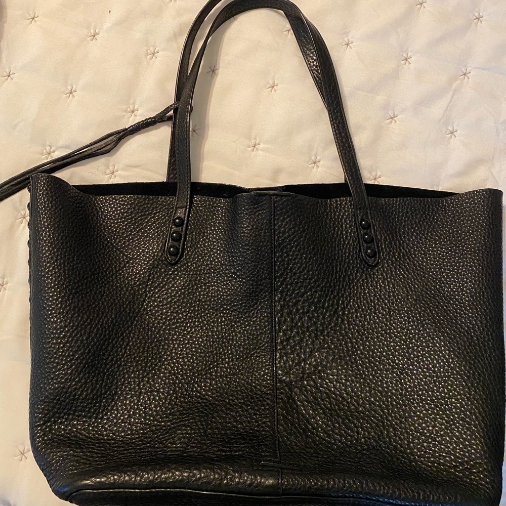 Black Rebecca Minkoff tote. Unstructured, unlined. Detachable pouch.